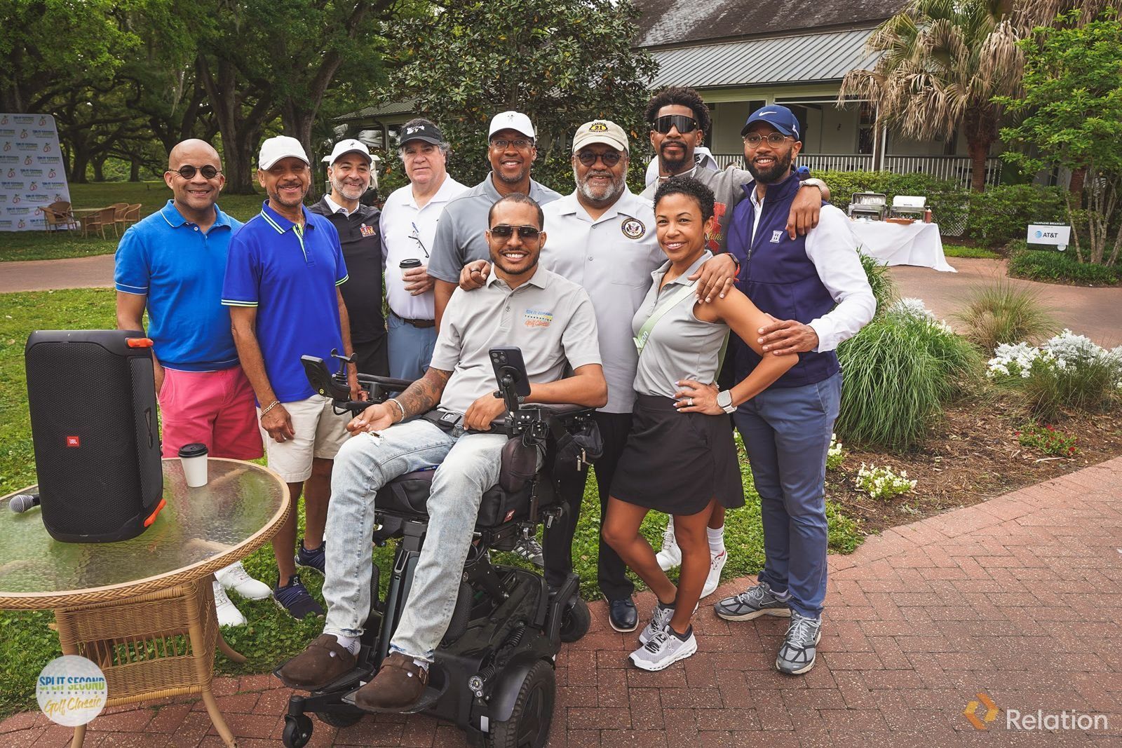 Mark Raymond Jr. with golfers and supporters outside the clubhouse at the Split Second Golf Classic