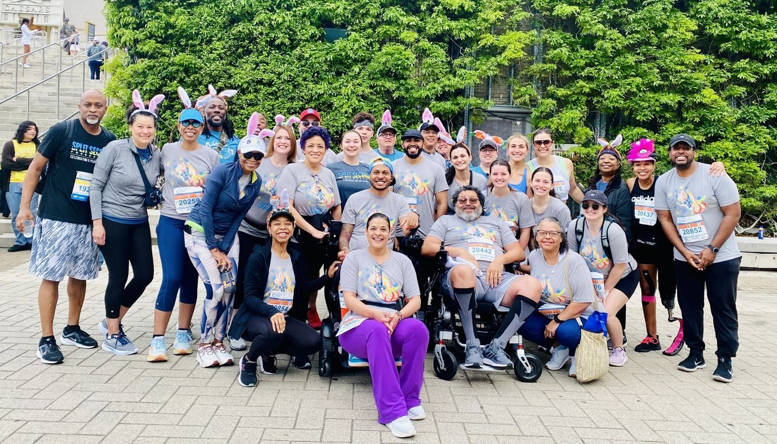 Team Split Second, including members using wheelchairs, gathered before the Crescent City Classic