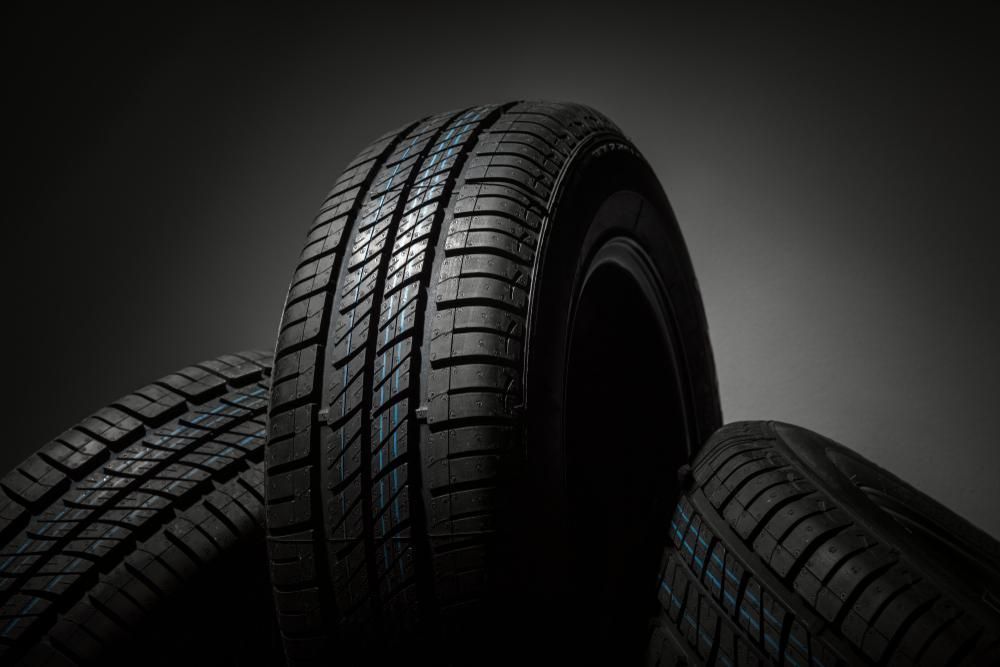Three Tires Are Stacked On Top Of Each Other On A Black Background — Summit Smash Toongabbie In Toongabbie, NSW