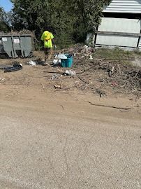 Takeaway Hauling crew member removing debris from roadside St. Louis