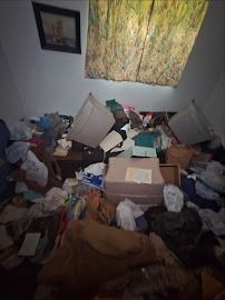 Cluttered room before residential junk removal in St. Louis MO