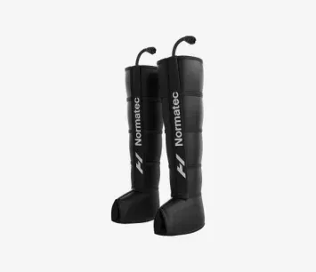 A pair of black normaltec compression boots on a white background.