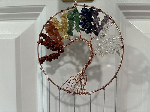 Pilates and Intuitive Energy Healing. dream catcher in the shape of a tree of life