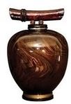 Decorative brown vase with swirling marbled pattern and a horizontal handle on top