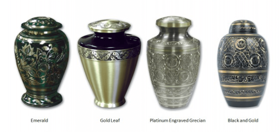 Four decorative metal funeral urns in green, silver, engraved silver, and black-gold finishes.