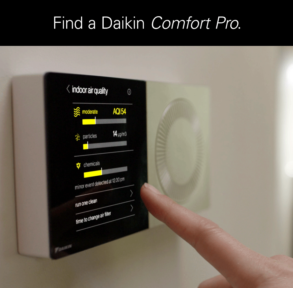 A person is pressing a button on a device that says find a daikin comfort pro