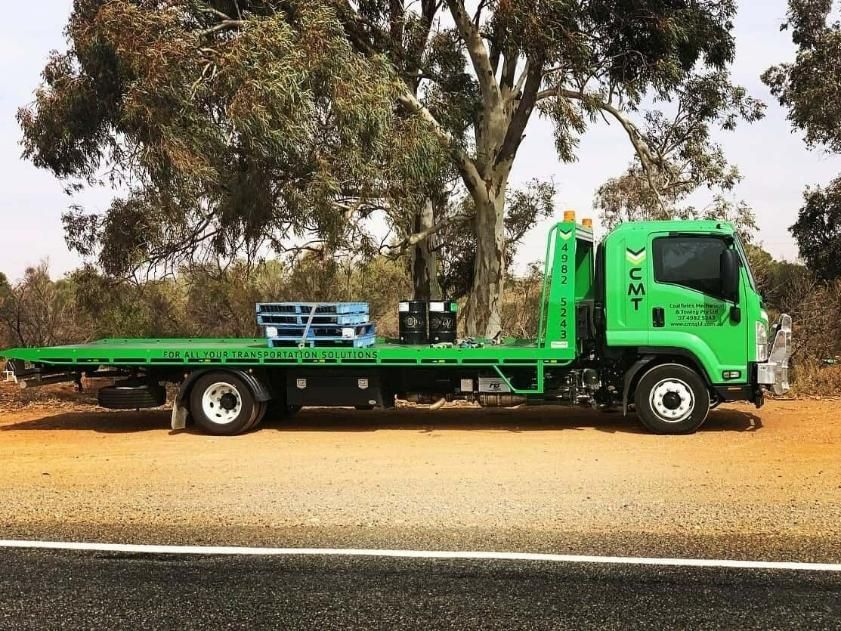 A Green Tow Truck Is Parked on The Side of The Road — Coalfields Mechanical & Towing in Blackwater, QLD