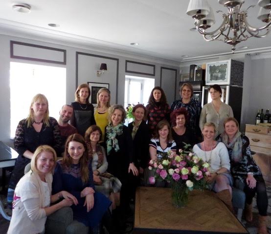 A group of people posing for a picture in a living room