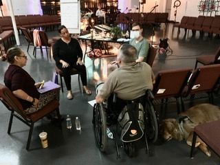 A group of people posing for a picture in a living room