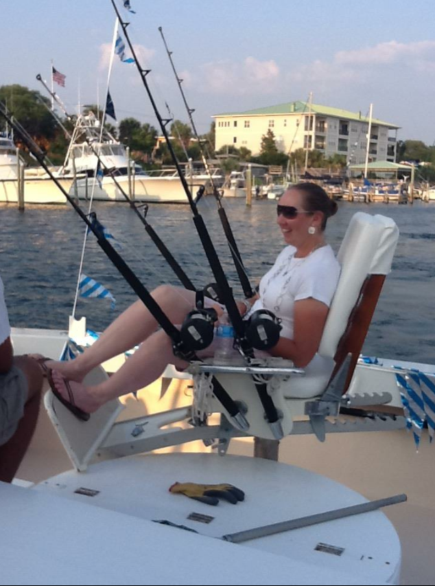 Fishing Destin, FL | Destin Harbor | Charter Boat Relentless | www.charterboatrelentless.com | A Luxury Charter Boat at Everyday Rates | 65' x 20' | A woman is sitting on a boat holding fishing rods