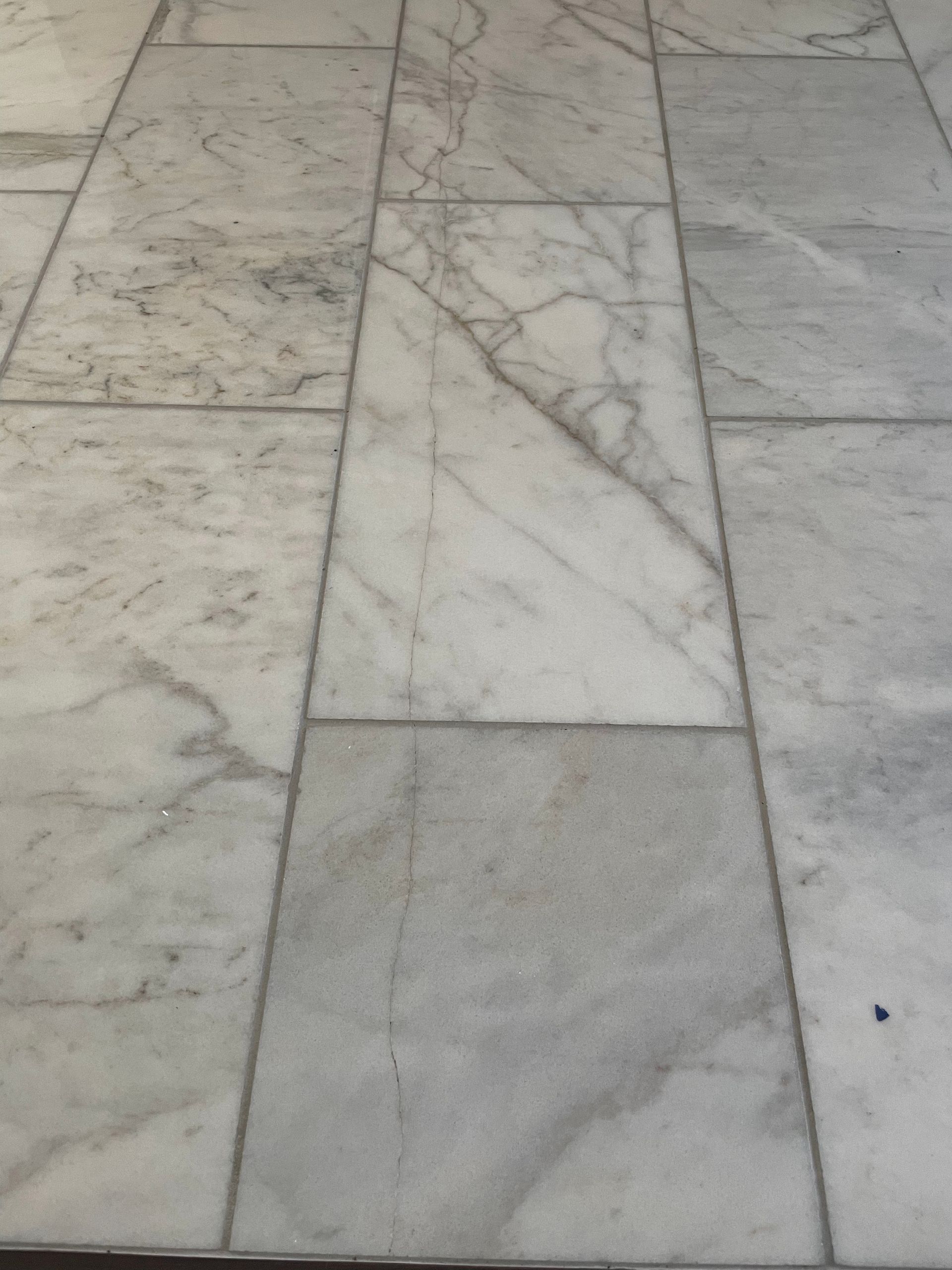 Gray stone pavement with rectangular tiles and subtle marble veining