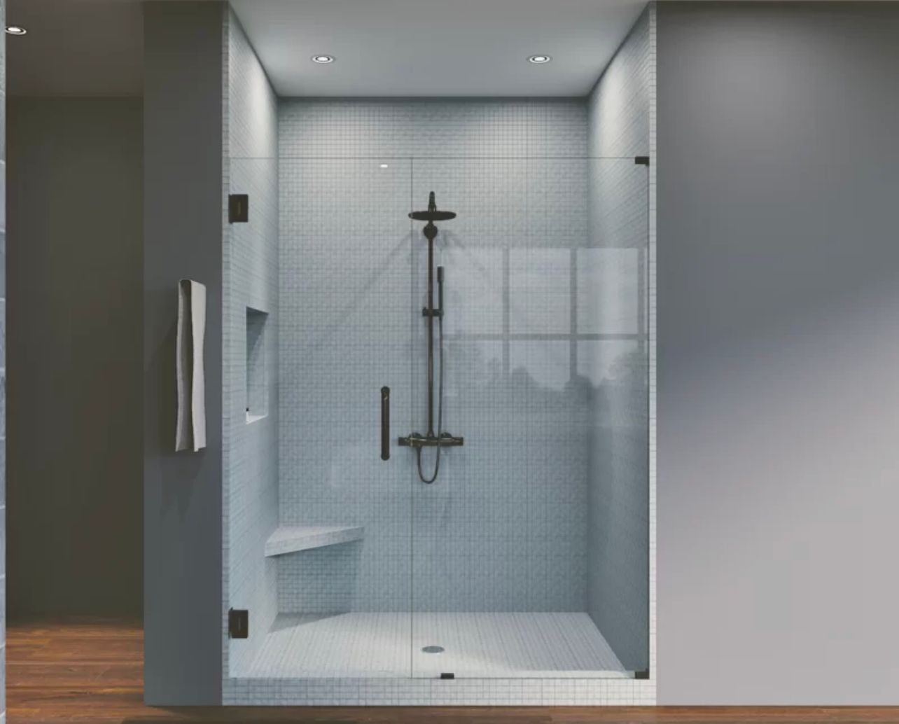 Modern glass shower stall with white tile, chrome fixtures, and a built-in bench in a minimalist bathroom