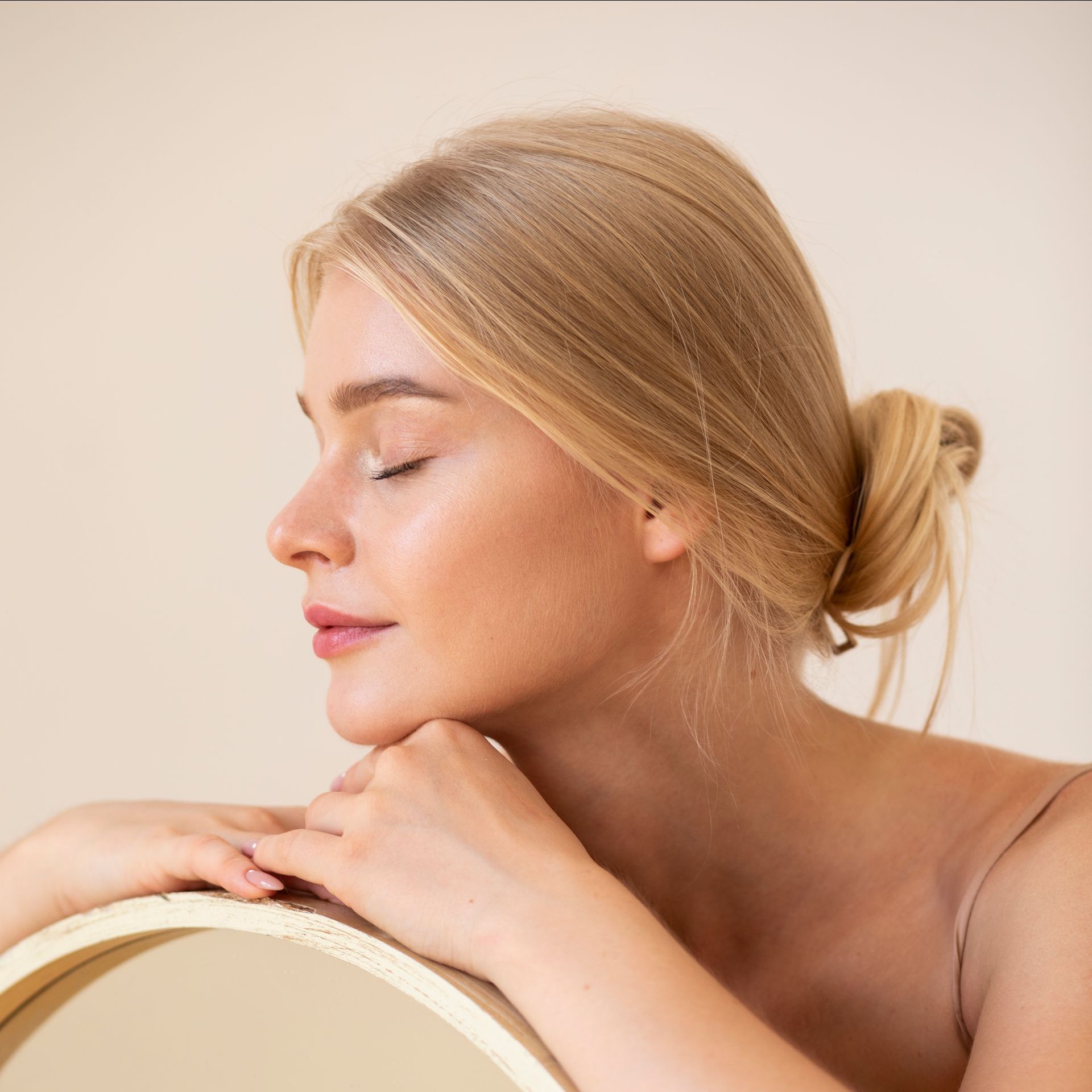 blond woman with clear glowing skin