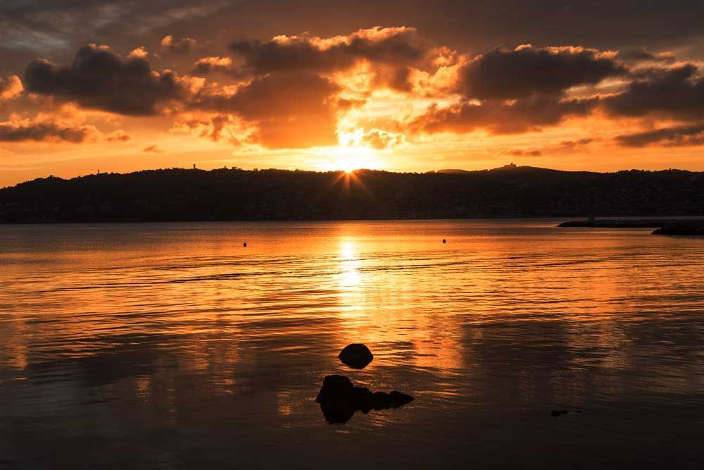 Scenic Sunset Over Mountains and Sea — Town & Country Plumbing Victoria in Ballan, VIC