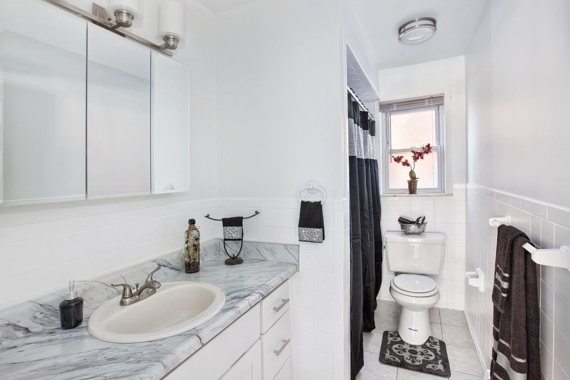 Bright apartment bathroom with marble vanity, mirror, and toilet.
Ready to make Joralemon your home? Contact us today to learn more about our pet-friendly 1, 2, and 3-bedroom apartments for rent in Belleville, NJ. We can’t wait to welcome you home!