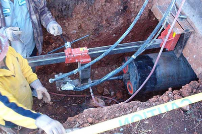 Back Hoe Loading On A Truck — Knoxville, Tennessee — True-Line Coring & Cutting Back Hoe Loading On A Truck — Knoxville, Tennessee — True-Line Coring & Cutting