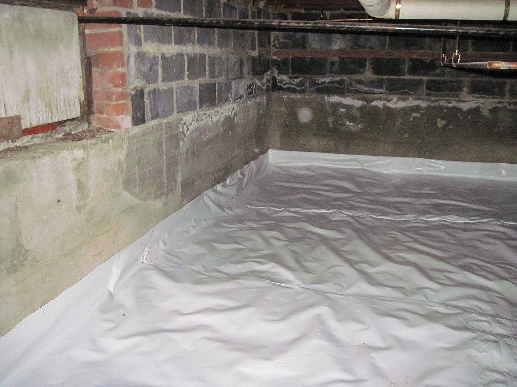 Crawlspace encapsulation sealed with vapor barrier that prevents water leaking into your crawlspace creating serious waterdamage to your home
