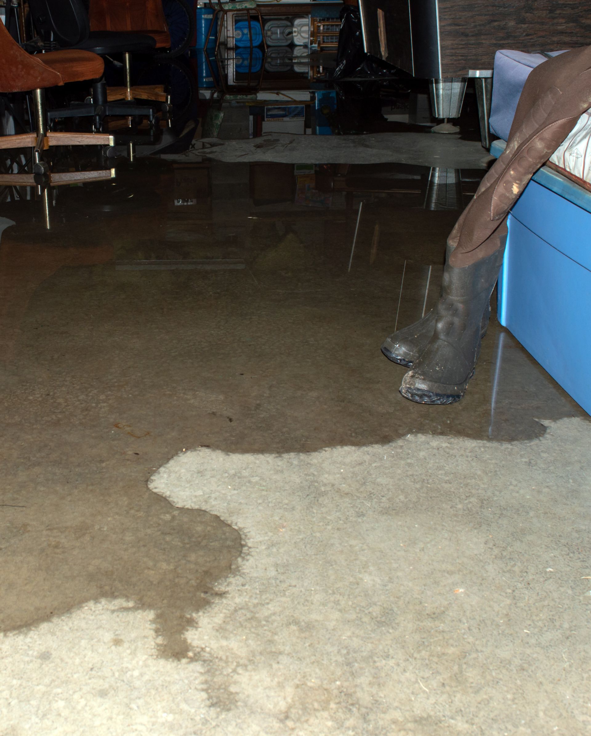 Flooded basement interior with water covering the floor that can lead to serious water damage within your home