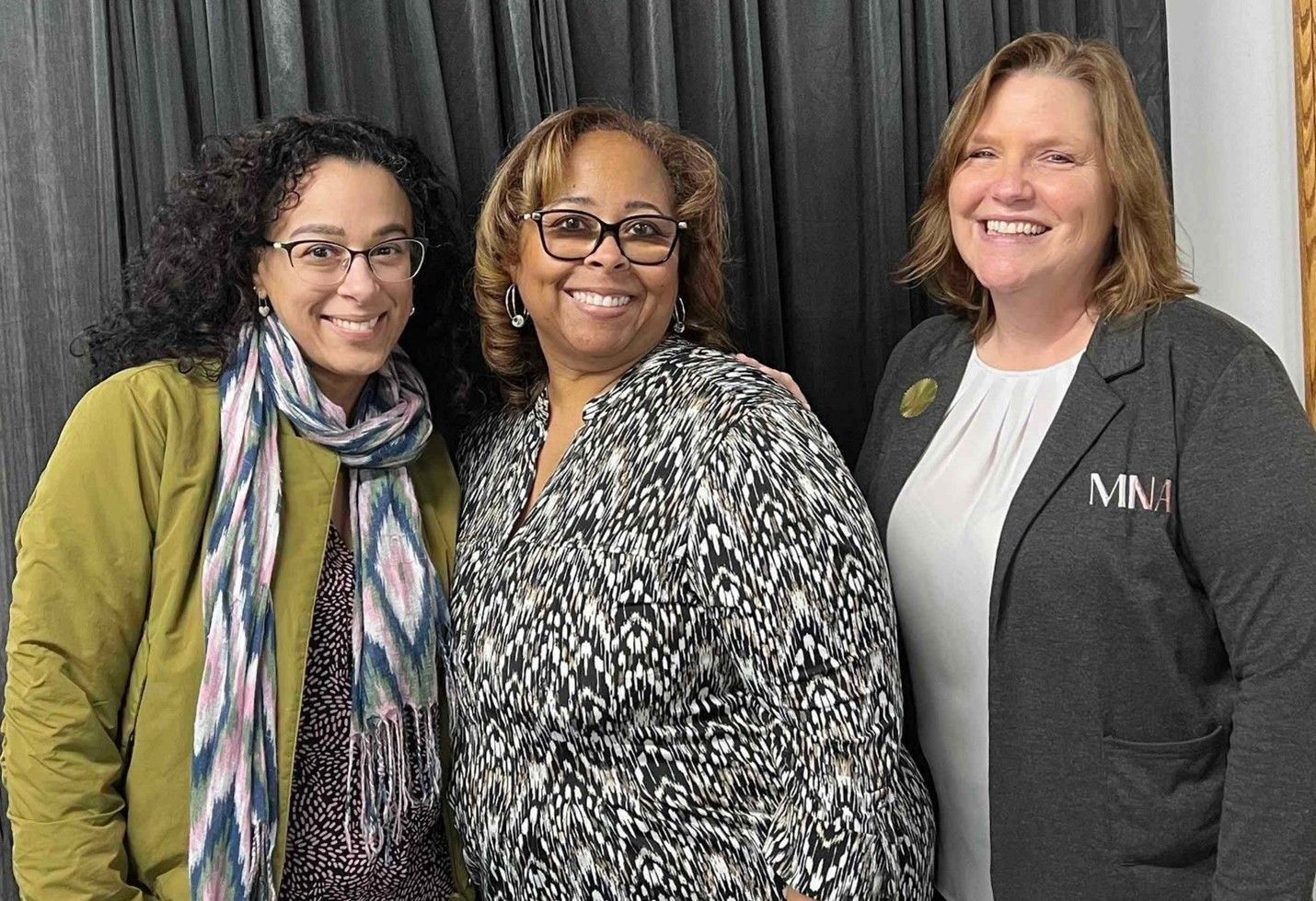 Pictured left to right: Nevine Rizk (MINA Member), Deborah Lowery (MINA Co-Founder), and Leslie Hocker (MINA Co-Founder) are posing for a picture together and smiling.