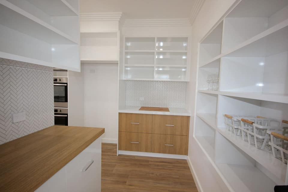 White and Wood-toned Pantry With Shelves and Cabinets — Payton Kitchens In Wilsonton, QLD