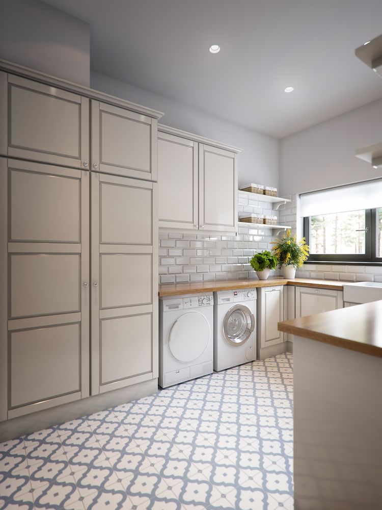 Laundry Room With Light Grey Cabinets, White Appliances, and Patterned Tile Floor — Payton Kitchens in St George, QLD