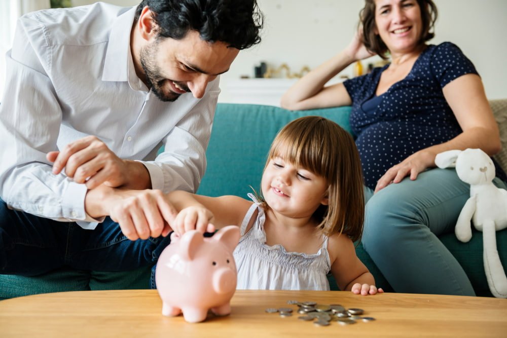 A Family Teaching Their Kid How To Save — Financial Planner in Winnellie, NT
