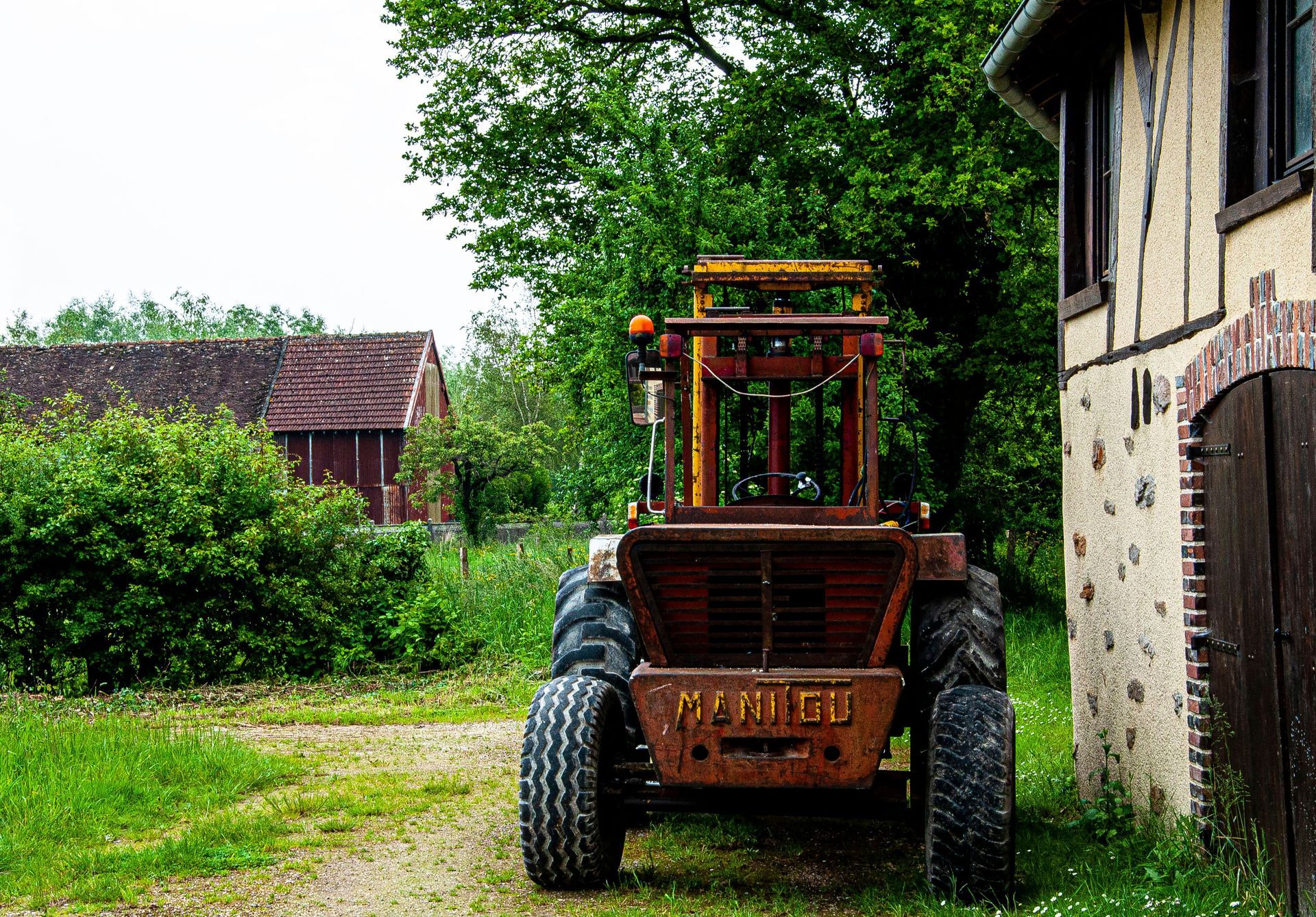 Brush-clearing equipment working on a St. Louis property