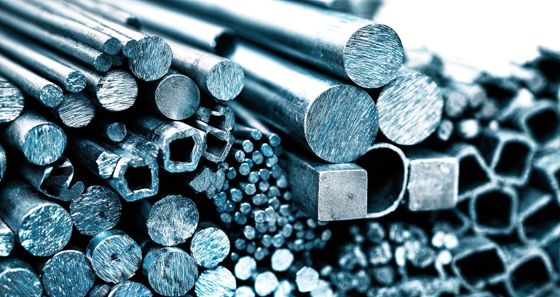 A collection of various metal rods and bars, showcasing different shapes and sizes, reflecting industrial materials in a polished, metallic finish. A collection of various metal rods and bars, showcasing different shapes and sizes, reflecting industrial materials in a polished, metallic finish.