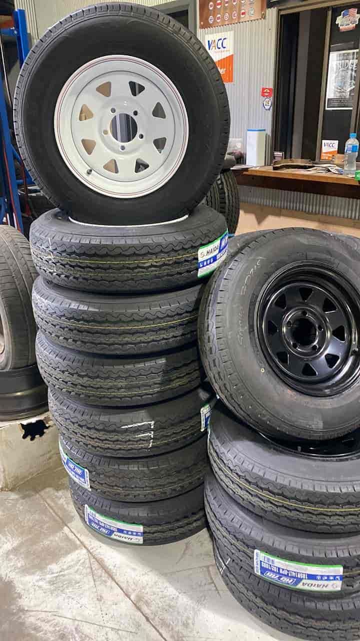 A Pile of Tyres and Wheels Are Stacked on Top of Each Other — ARB Budget Tyres in Delacombe, VIC