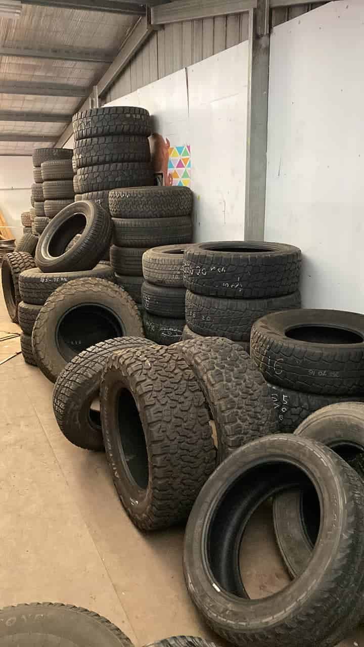 A Warehouse Filled With Lots of Tyres Stacked on Top of Each Other — ARB Budget Tyres in Delacombe, VIC