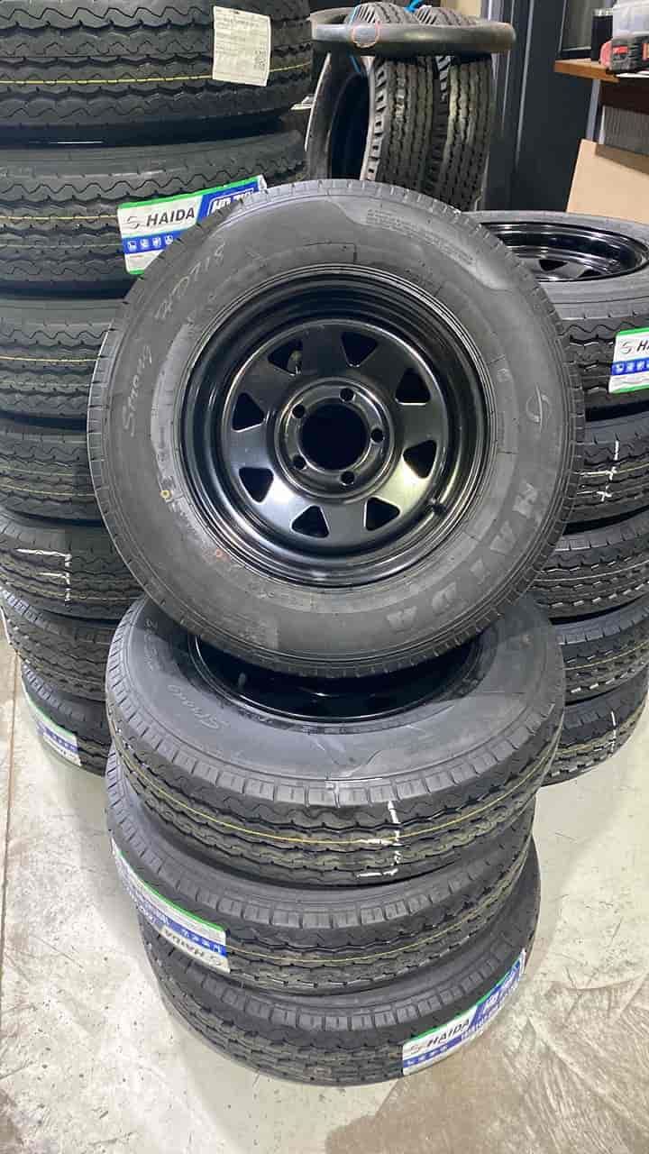 A Stack of Tyres and a Wheel Are Sitting on Top of Each Other — ARB Budget Tyres in Delacombe, VIC