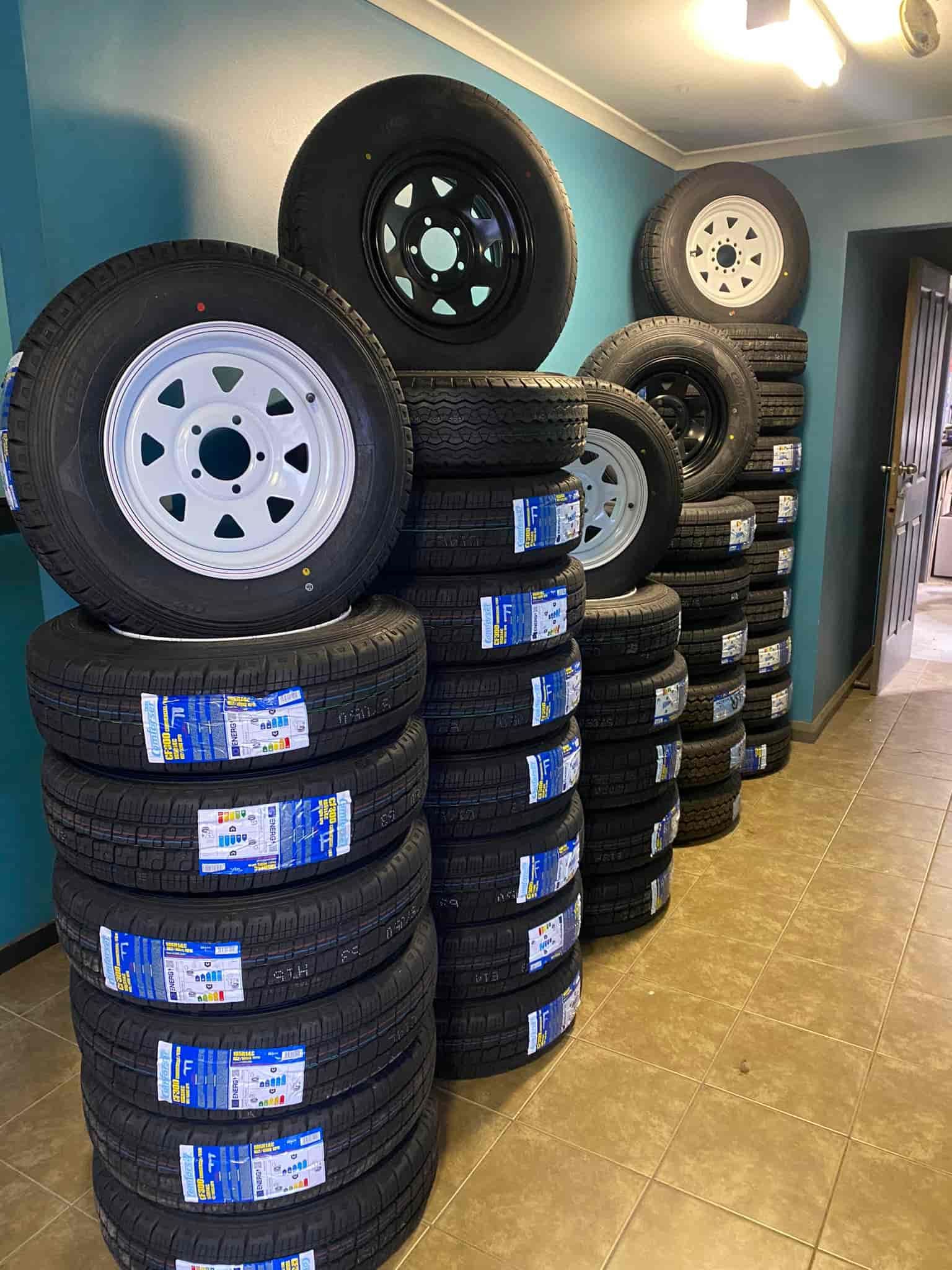 A Bunch of Tyres Are Stacked on Top of Each Other in a Room — ARB Budget Tyres in Delacombe, VIC