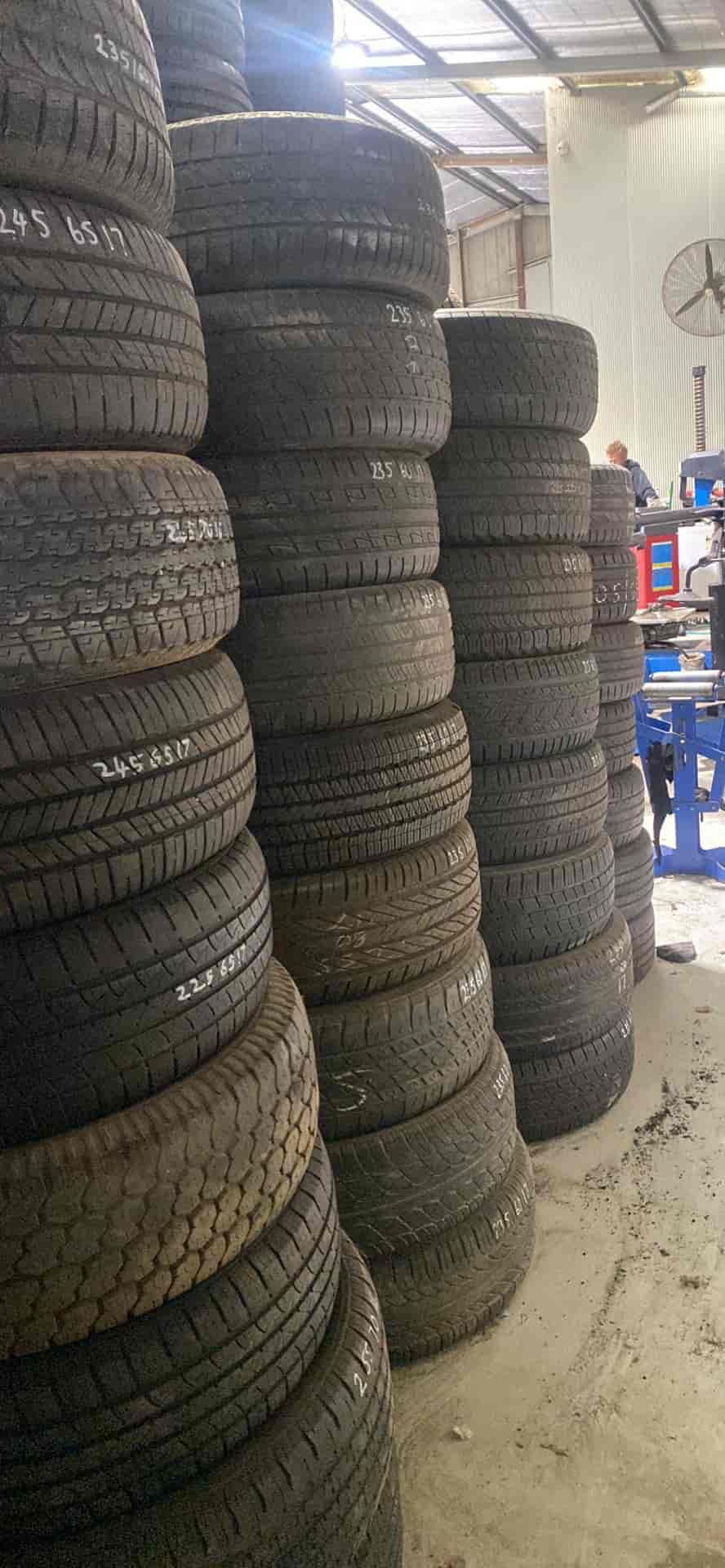 A Warehouse Filled With Lots of Tyres Stacked on Top of Each Other — ARB Budget Tyres in Delacombe, VIC