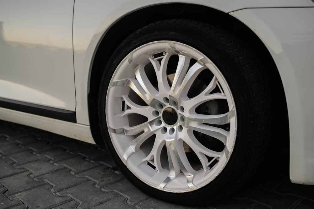 A Close Up of a White Car Wheel on a Brick Road — ARB Budget Tyres in Delacombe, VIC