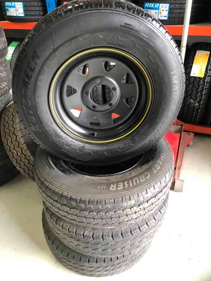 A Stack of Tyres and Wheels Are Sitting on Top of Each Other — ARB Budget Tyres in Delacombe, VIC