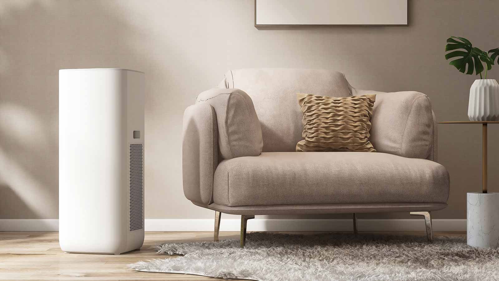 Modern living room with a beige armchair, floor air purifier, rug, and small side table with plant.