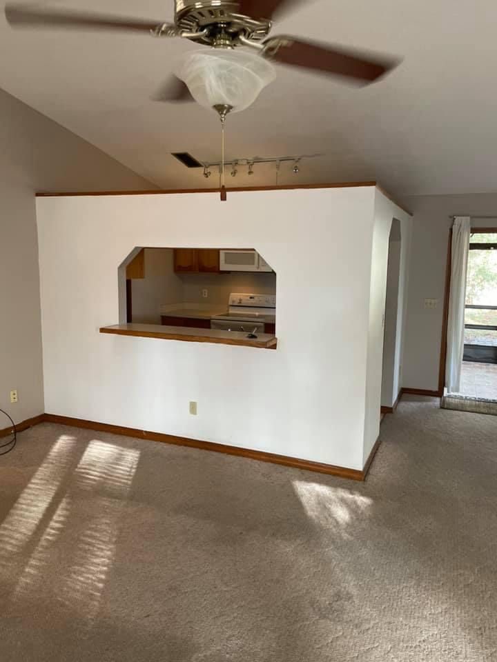old kitchen area with white breakfast counter wall