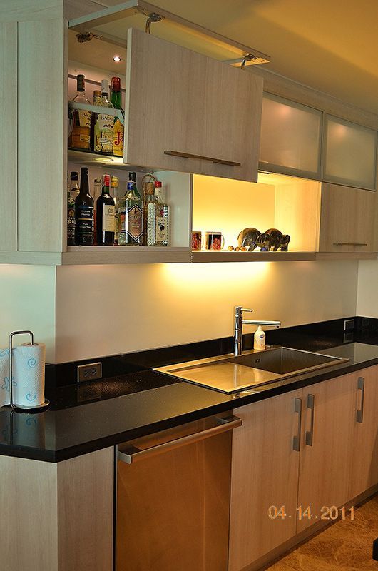Kitchen WIth Countertops and Wooden Cabinets — ModulPlus in Hervey Bay, QLD