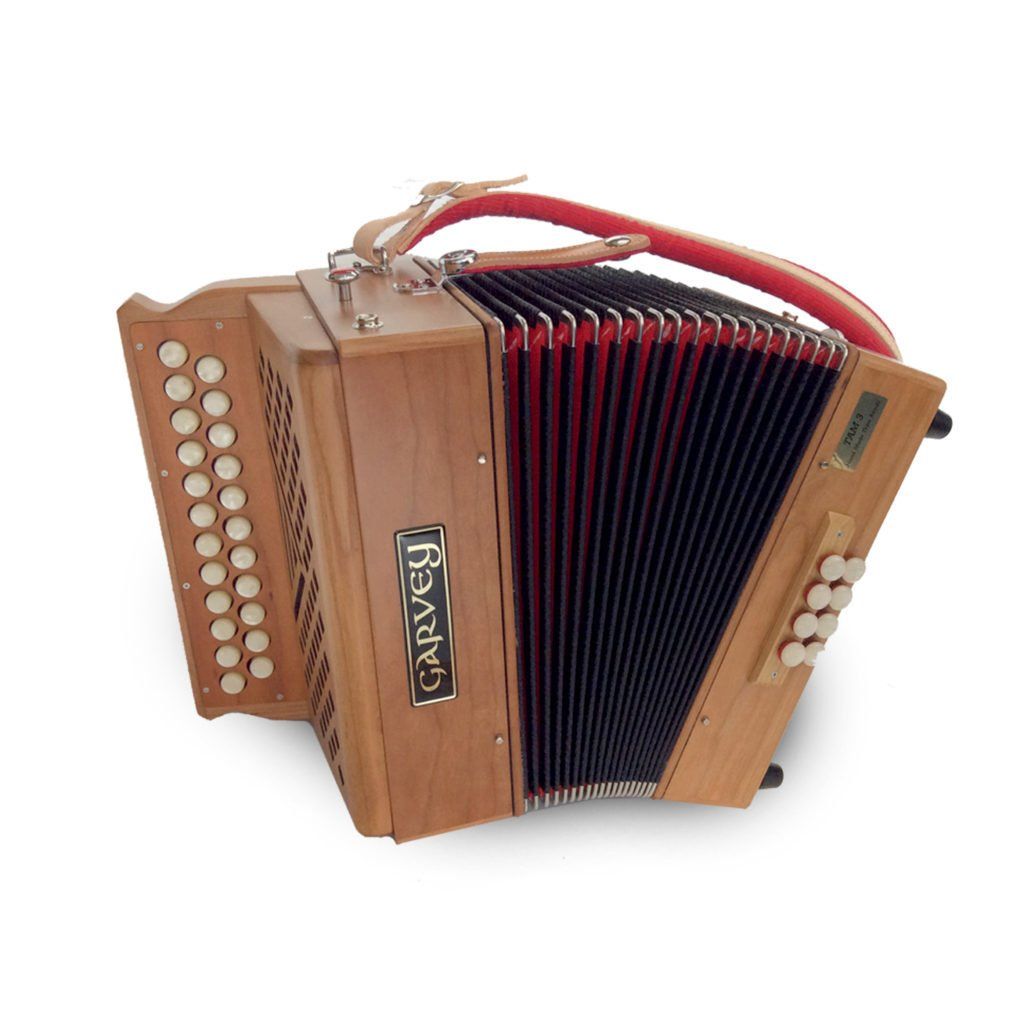 Accordion with wooden casing and red straps.
