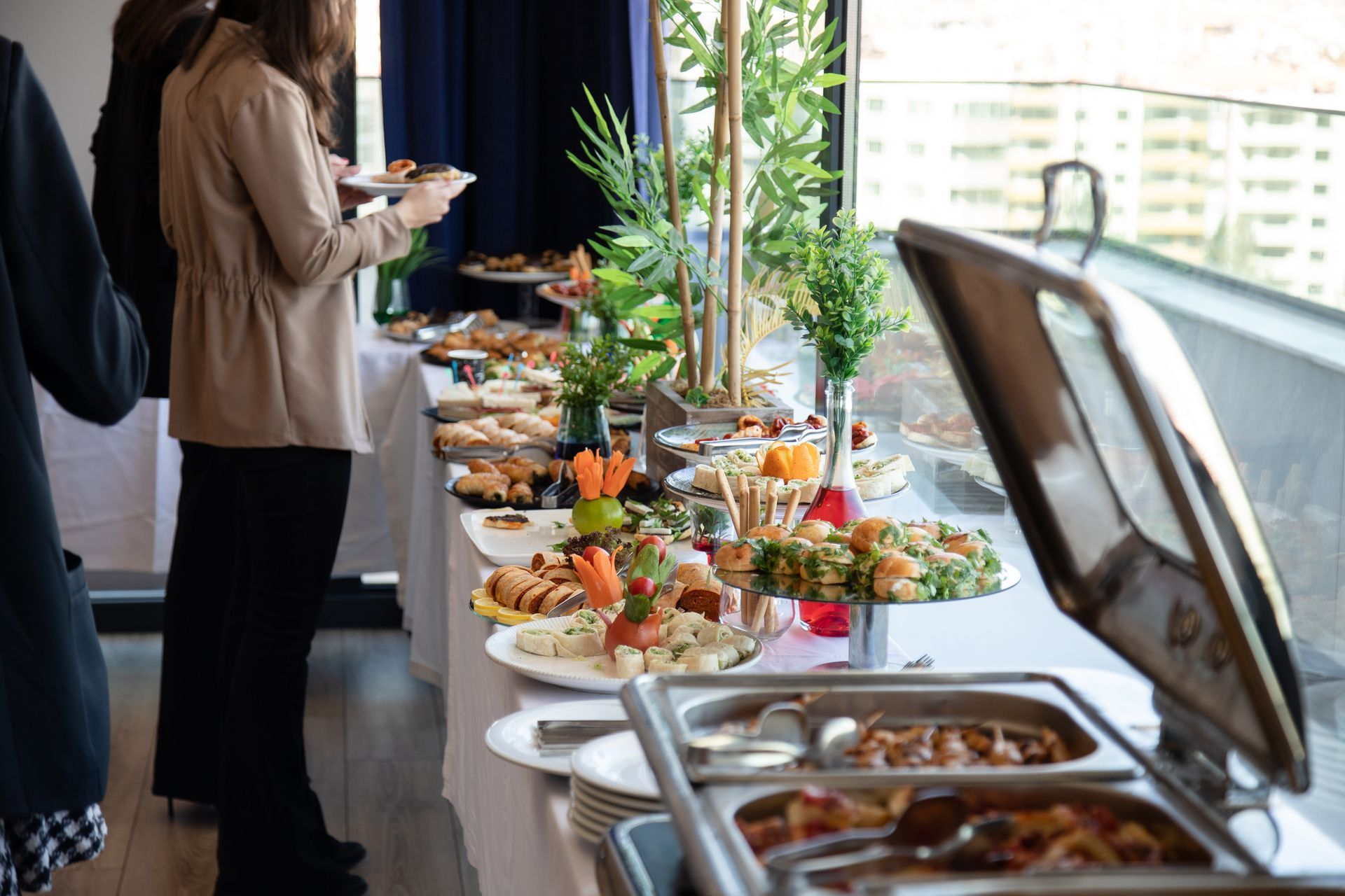 Banquet table set food dishes for a corporate catering event Banquet table set food dishes for a corporate catering event