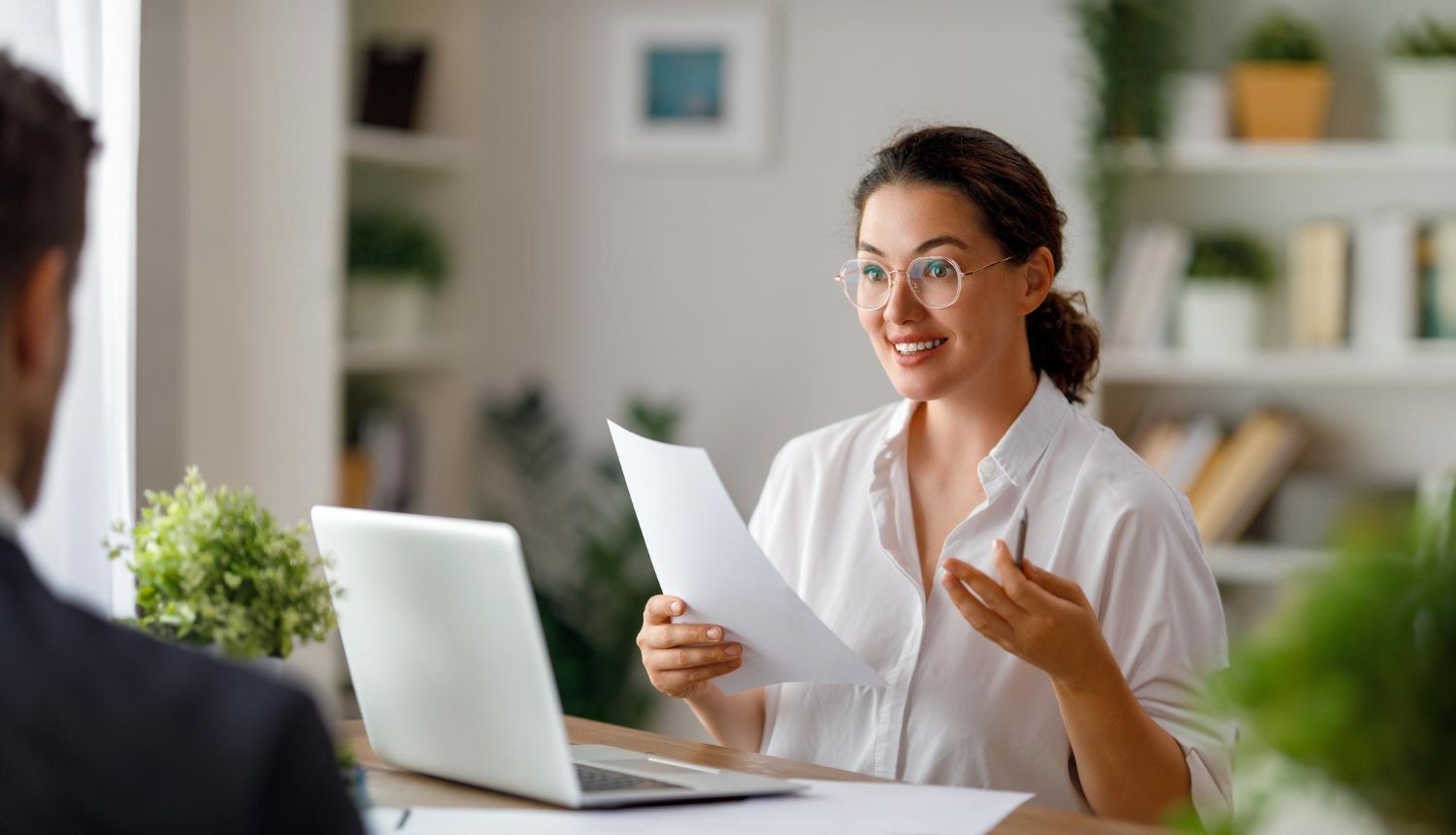 Business owner reviewing funding documents at home office
