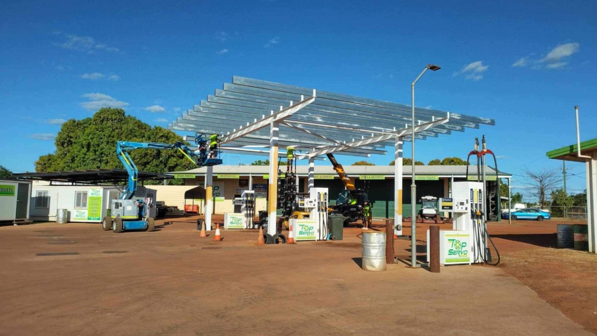Metals Being Installed on a Gas Station Canopy — Lincoln Fabrication in Miles End, QLD