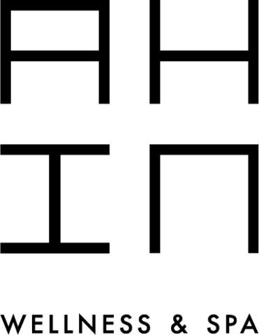 Un logotipo en blanco y negro para ah en bienestar y spa
