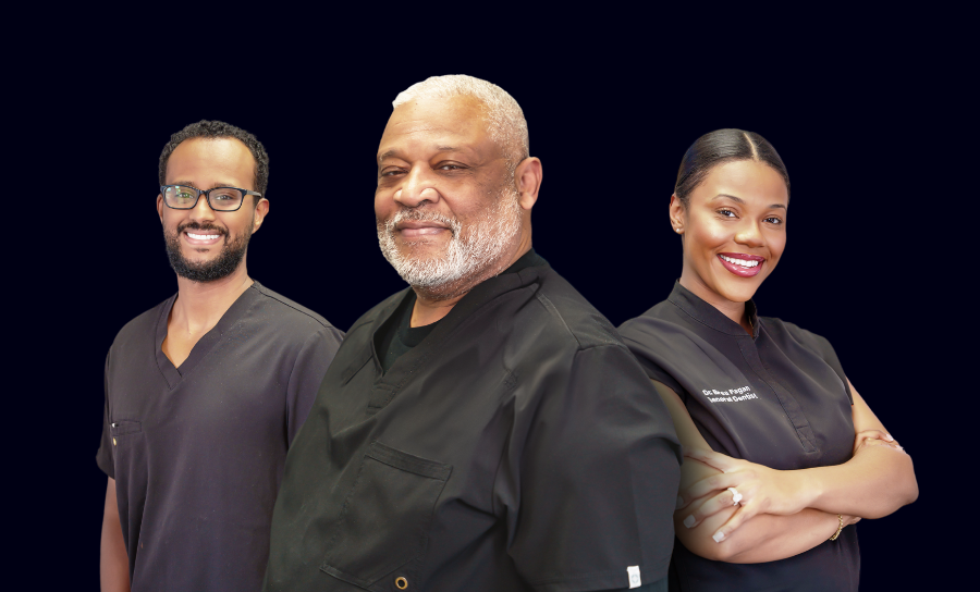 Dr. Davis in a suit and tie stands in front of a family dentistry