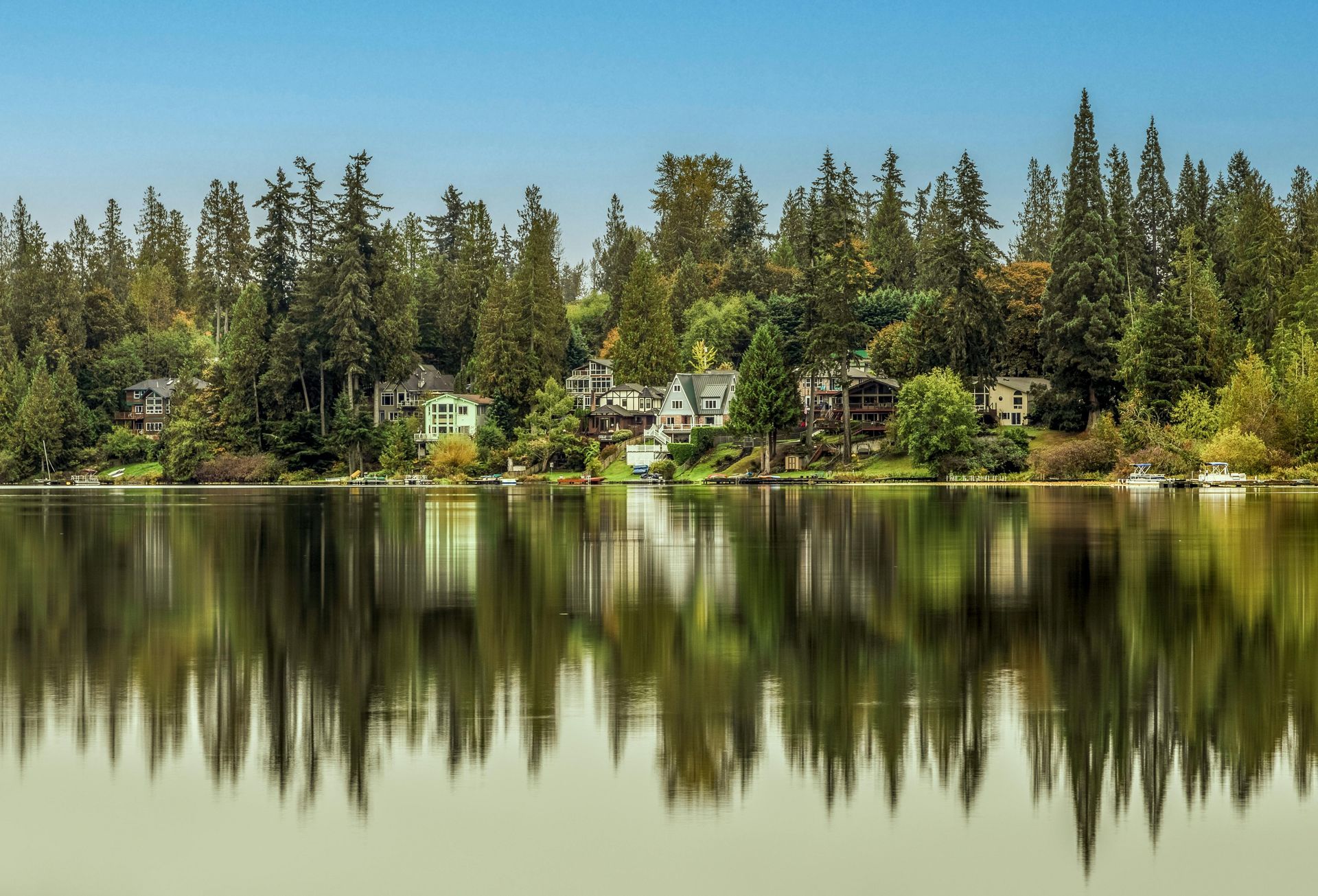 The skyline of New Jersey is reflected in a lake. The skyline of New Jersey is reflected in a lake.