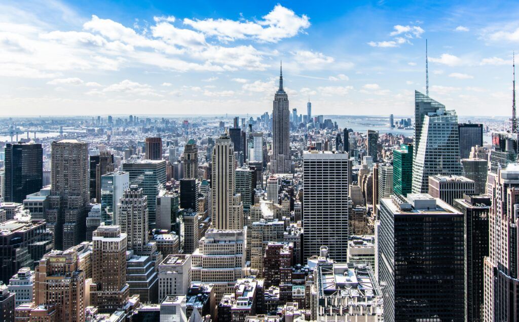 An aerial view of the skyline of New York City on a sunny day. An aerial view of the skyline of New York City on a sunny day.