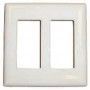 A white switch plate with two holes in it on a white background.