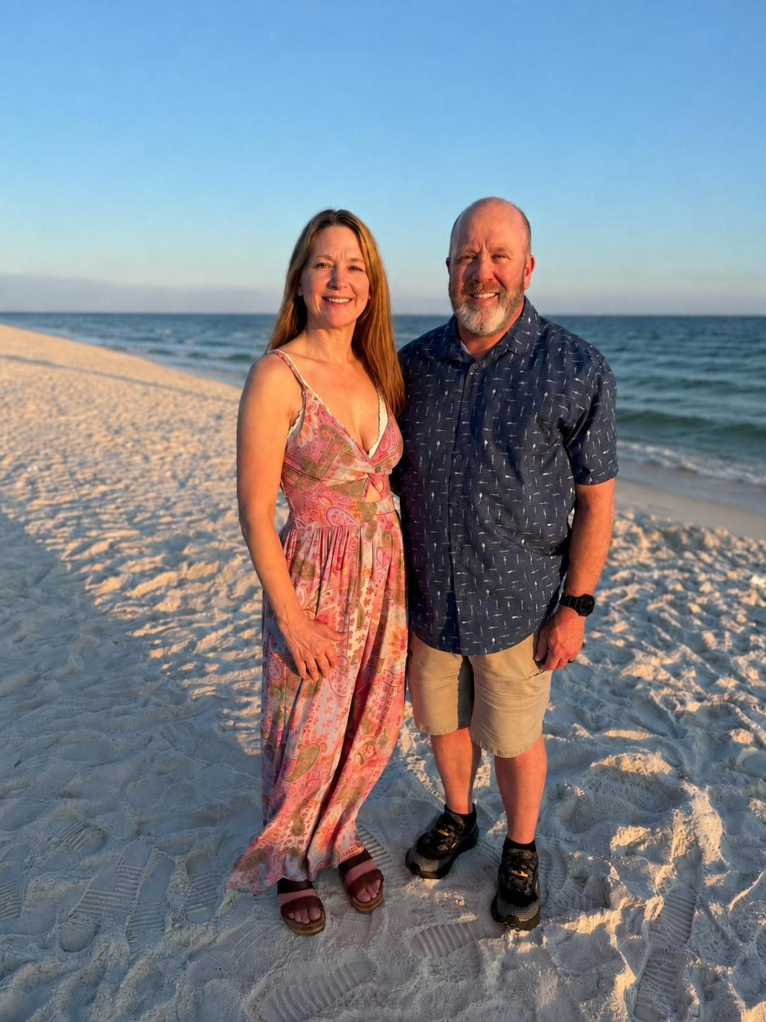 Dr Mellick and her husband on a beach