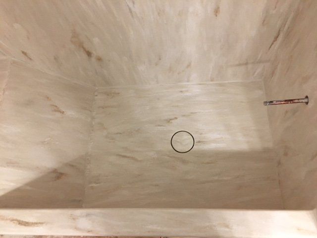 A wooden box with a hole in the middle of it.