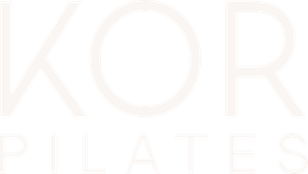 Pale beige logo text reading “KOR PILATES” on a white background